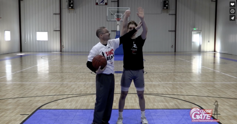 guide hand facing the rim with bad basketball shot form